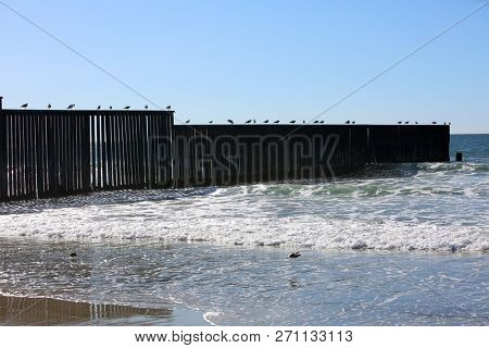 San Ysidro, California - 11/26/2018: Border and new fencing along the international border between San Diego, California and Tijuana, Mexico leads into the pacific ocean. 
