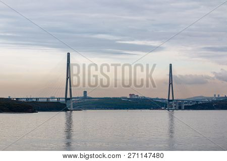 Suspended Cable Russian Bridge From The Mainland Of The Far-eastern City Of Vladivostok To The Russk