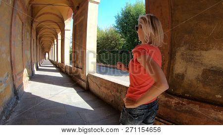 Sporty Running Woman Under The Archway San Lucas Portico. San Luca Sanctuary On Bologna City Hills, 