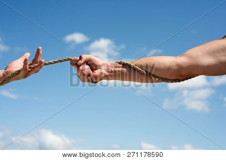 Pull Untill The Very End. Tug War Is Sport. Physical Strength And Muscular Power. Male Hands Pull Op