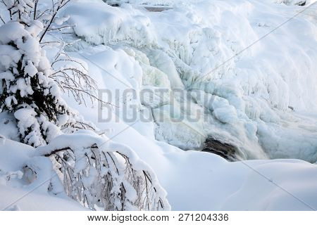 frozen waterfall Tannforsen in winter, Sweden