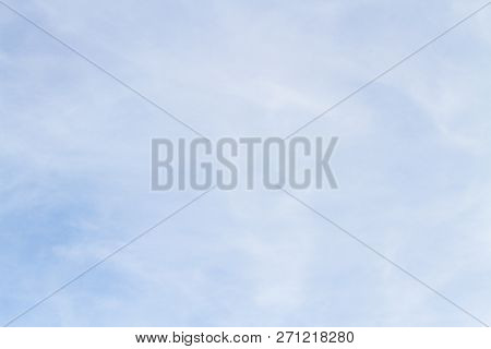 Blue Sky With White Porous Clouds In Summer