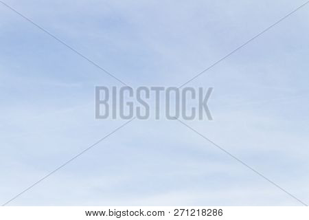 Blue Sky With White Porous Clouds In Summer
