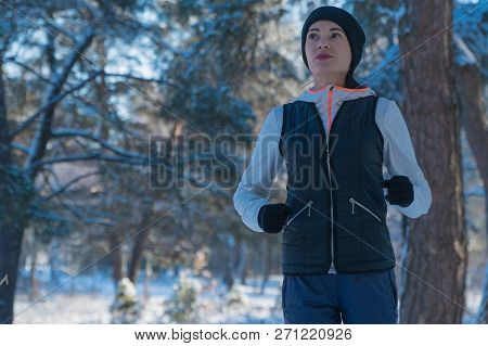 Running Winter Snow Running Girl Runs Through The Woods In Winter Sport Winter. Healthy Lifestyle