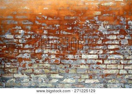 Detial Of An Old Brick Wall With Ocre Tones