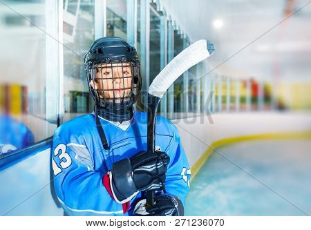 Young Ice Hockey Player In Protective Equipment