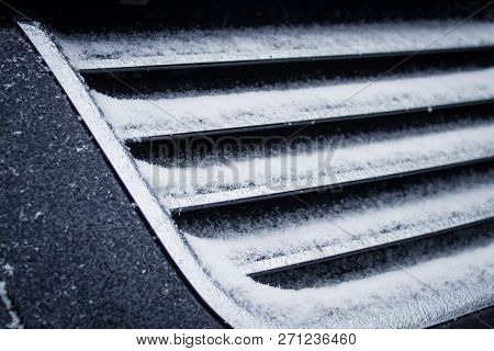 The Frozen Grille Of The Car. The Silver Grille Of The Car In The Snow