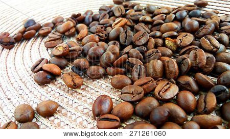 Roasted Brown Coffee Beans On Cloth Background