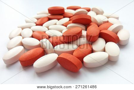 Assorted colorful pharmaceutical medicine pills, tablets and capsules on white background. Pharmacy
