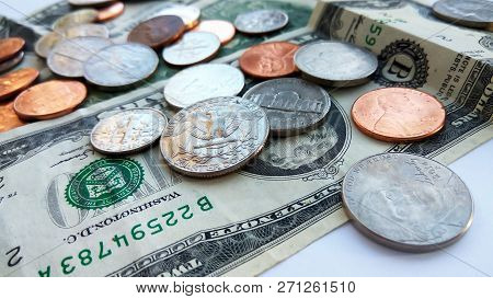 Close Up American Quarter, Dime And Penny Coins On Two Dollars Usa Background