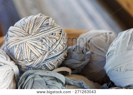Closeup Of Basket Full Of A Blue, White And Brown Ball Of Matte Crumble