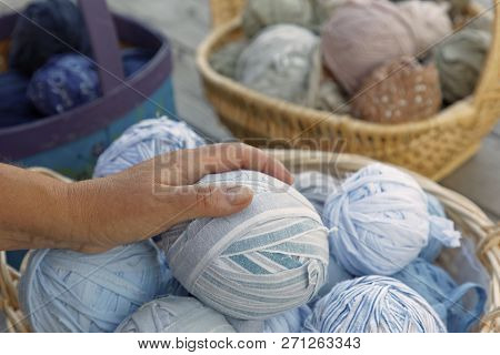 Womans Hand Holding A Blue Ball Of Matte Crumble