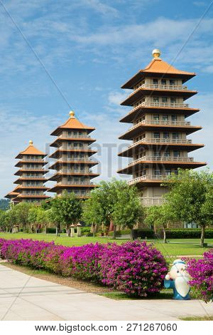 Pagodas each representing different ideas or precepts with purple flowers