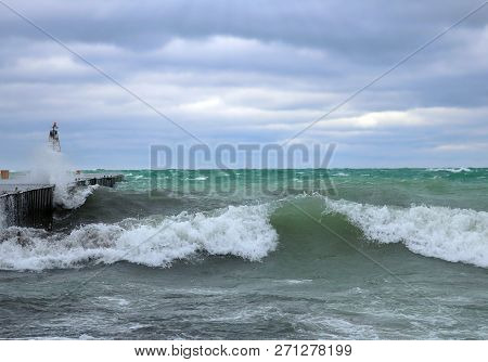 Large Rolling Wave Coming In Along Pier During November Wind Storm In Kincardine, Ontario