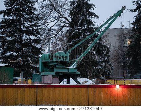 Small Portable Crane At Plumbing Pipelaying Construction Site