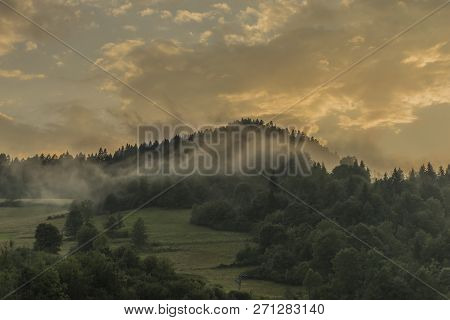Orange Sunset With Fog After Storm In Lesnica Village In Pieniny National Park