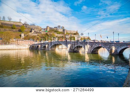 Classic View Of The Historic Town Of Namur With Famous Old Bridge Crossing Scenic River Meuse In Sum