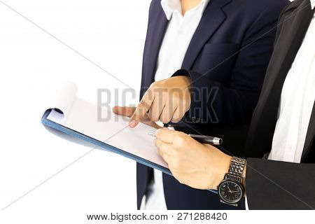 Businesspeople One Person Hand Pointing Document And Another Signing Contract.