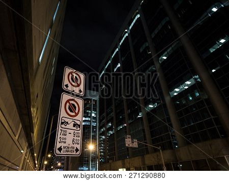 Typical North American Paking And No Parking Signs With Detailed Instructions On The Parking Regulat