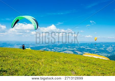 Skydiving Training In Mountains,  Flying Above The Distant Hills. Parachute Extreme Sport.   Absolut