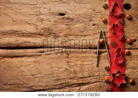 Christmas Wooden Background With Christmas Nuts Sortiment.