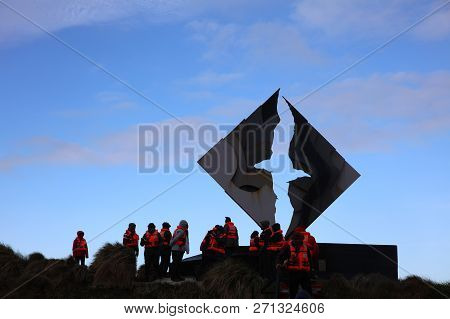 Cape Horn, Chile - October 31,2018: Tourists At The Monument On Hornos Island. Cape Horn. Chile