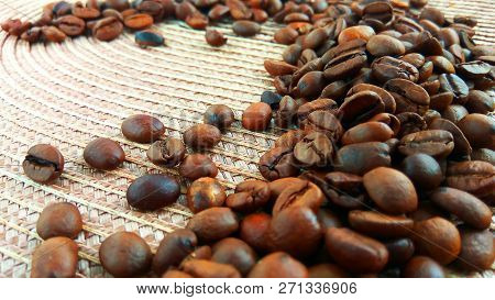 Roasted Brown Coffee Beans On Cloth Background