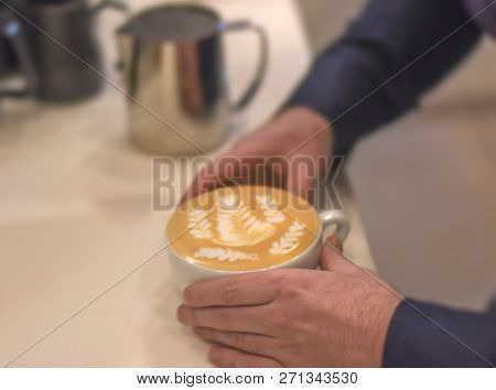 Fresh Tasty Cafe Latte With Latte Art In Barist Hands In Cafeteria