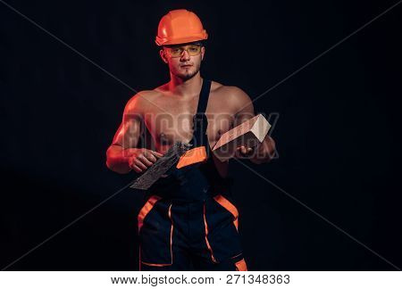 Our Reputation Is As Solid As Concrete. Muscular Man Does Masonry Work. Bricklayer Worker. Construct