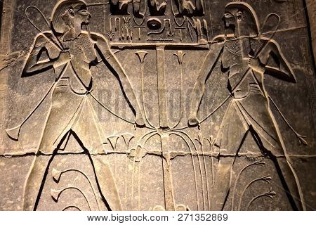 Egyptian Hieroglyphs And Drawings On The Walls And Columns. Egyptian Language, The Life Of Ancient G