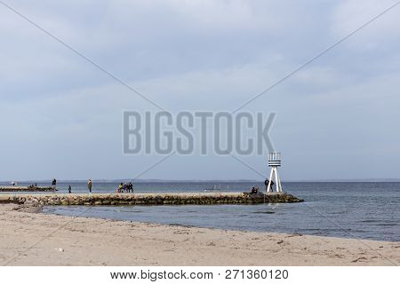 Klampenborg, Denmark - March 25, 2017:  People At One Of The Iconic Lifeguard Towers At Bellevue Bea