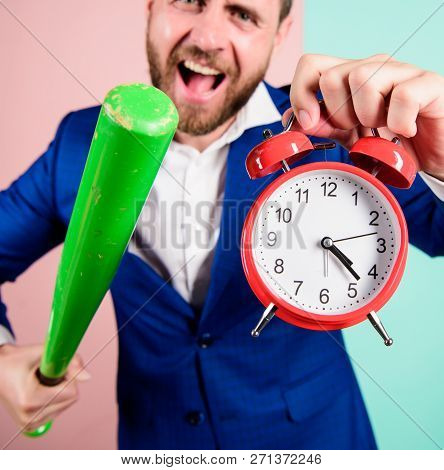 Discipline And Sanctions. Boss Aggressive Face Hold Alarm Clock And Baseball Bat. Man Suit Hold Cloc