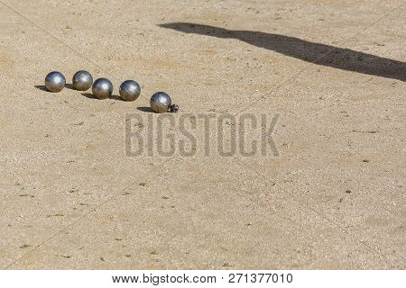 Petanque Balls On The Game Track While The Match Is Played