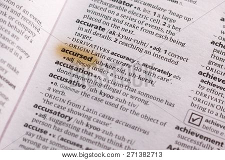 The Word Or Phrase Accursed In A Dictionary Highlighted With Marker.