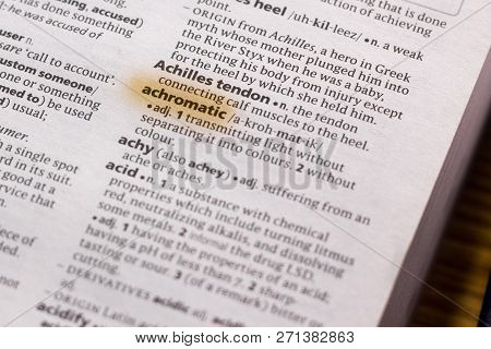 The Word Or Phrase Achromatic In A Dictionary Highlighted With Marker.