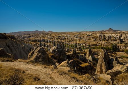 Cappadocia, Turkey: Beautiful Landscape On The Panorama Of Mountains And Rocks. The Fortress Of Uchi