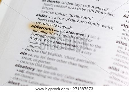 The Word Or Phrase Alderman In A Dictionary Highlighted With Marker.