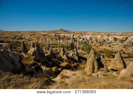 Cappadocia, Turkey: Beautiful Landscape On The Panorama Of Mountains And Rocks. The Fortress Of Uchi