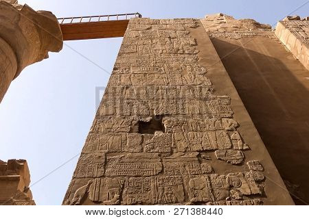 Egyptian Hieroglyphs And Drawings On The Walls And Columns. Egyptian Language, The Life Of Ancient G