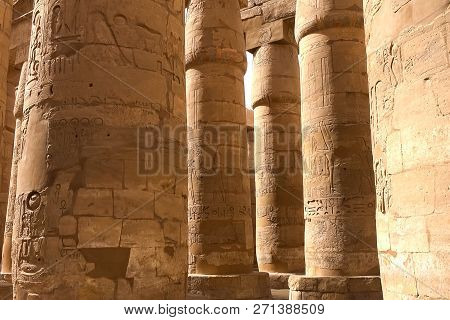 Egyptian Hieroglyphs And Drawings On The Walls And Columns. Egyptian Language, The Life Of Ancient G
