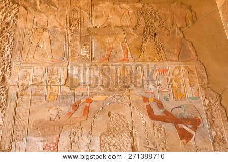 Egyptian Hieroglyphs And Drawings On The Walls And Columns. Egyptian Language, The Life Of Ancient G