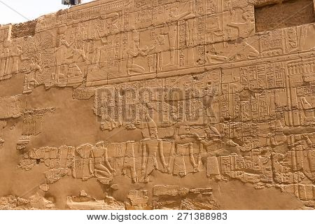 Egyptian Hieroglyphs And Drawings On The Walls And Columns. Egyptian Language, The Life Of Ancient G