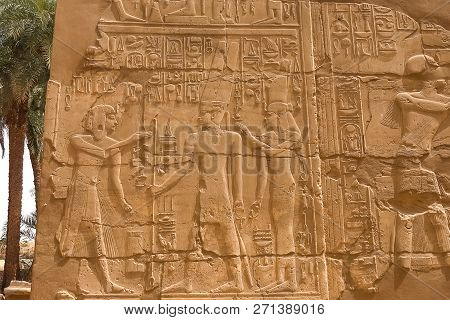 Egyptian Hieroglyphs And Drawings On The Walls And Columns. Egyptian Language, The Life Of Ancient G