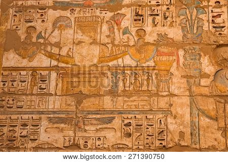 Egyptian Hieroglyphs And Drawings On The Walls And Columns. Egyptian Language, The Life Of Ancient G