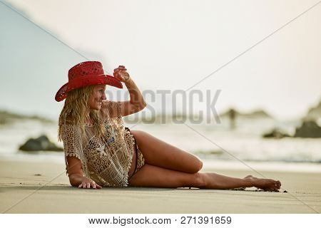 young woman relaxing on the beach in summer day
