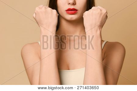 Cute Woman Shows Fist At Camera, Threatens You About Something, Has Displeased Sullen Facial Express