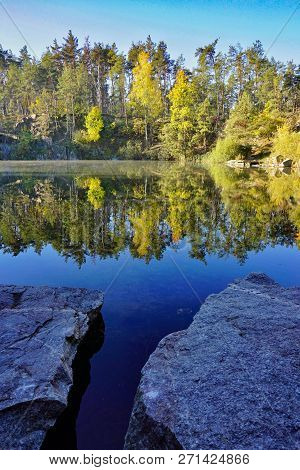 Korostyshevsky Quarry, Zhytomyr Region, Ukraine. Beautiful Landscape With Forest Reflection In Water