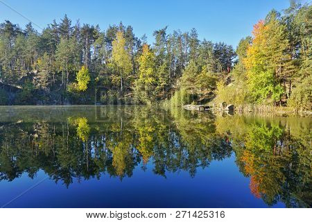 Korostyshevsky Quarry, Zhytomyr Region, Ukraine. Beautiful Landscape With Forest Reflection In Water
