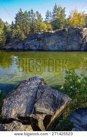 Korostyshevsky Quarry, Zhytomyr Region, Ukraine. Beautiful Landscape With Forest Reflection In Water