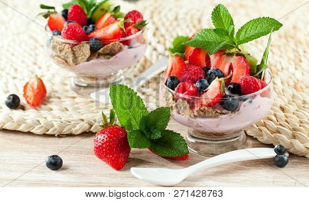 Summer Dessert With Strawberries On A Wooden Background.